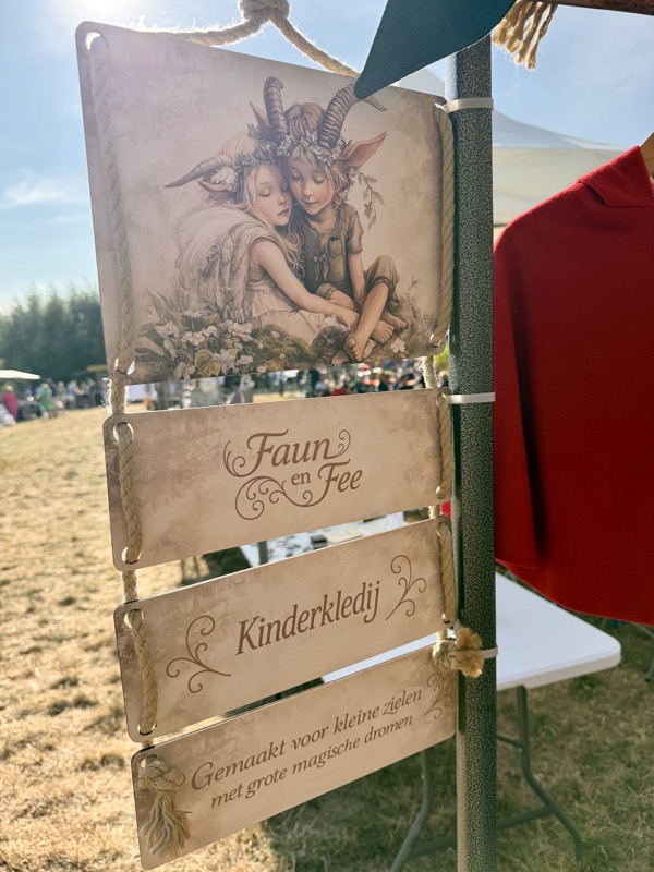 Hanging printed signs for the Faun en Fee market stand